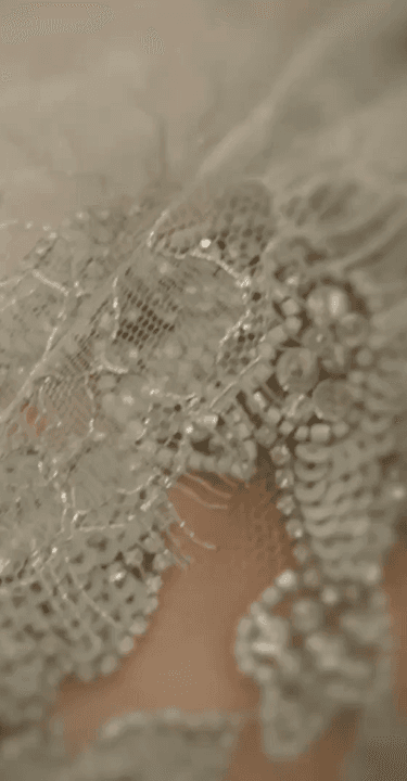 Elegant model seated on wooden staircase