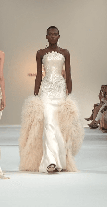 Elegant model seated on wooden staircase